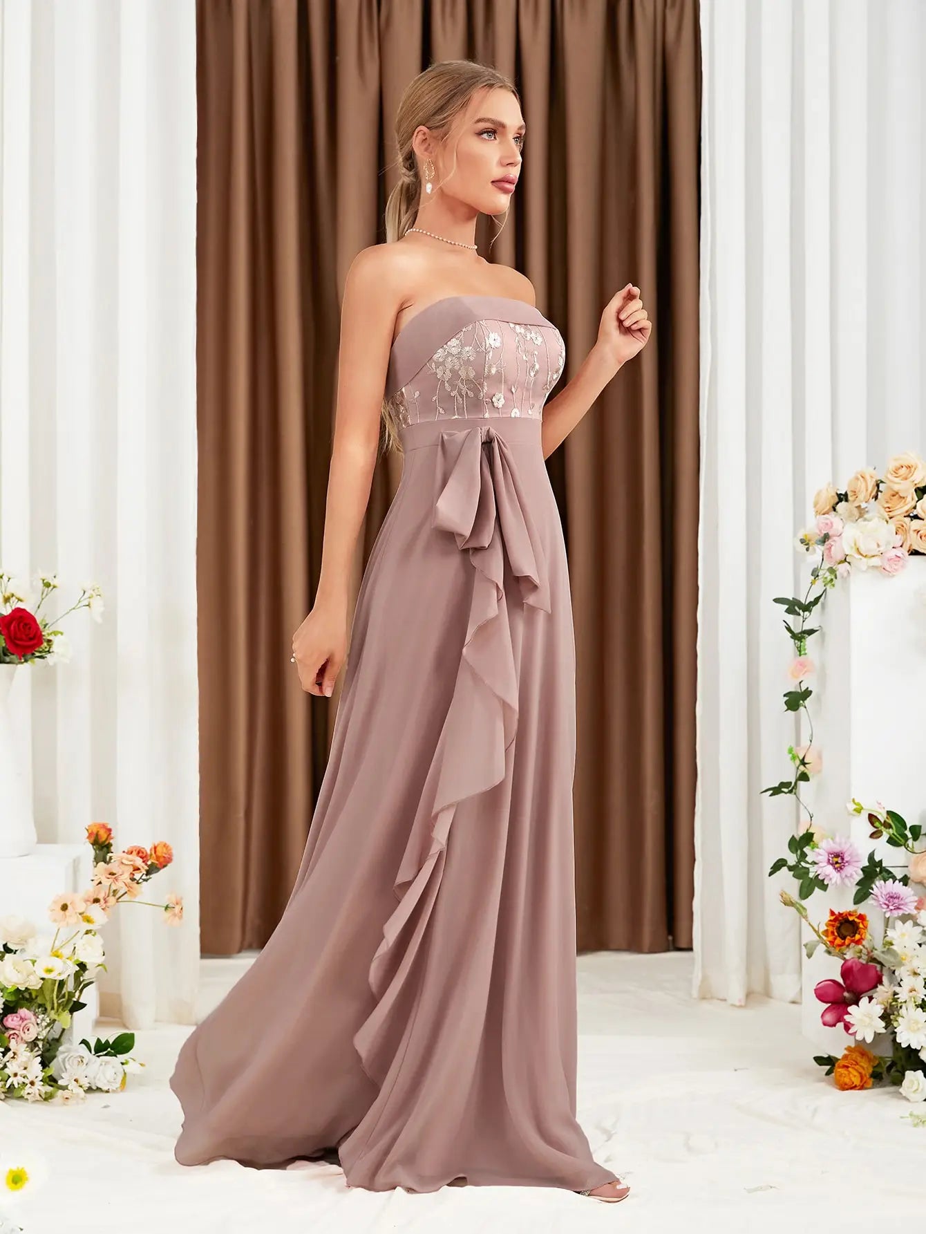 The adult formal dress is wrapped around the chest and decorated with a belt on the back